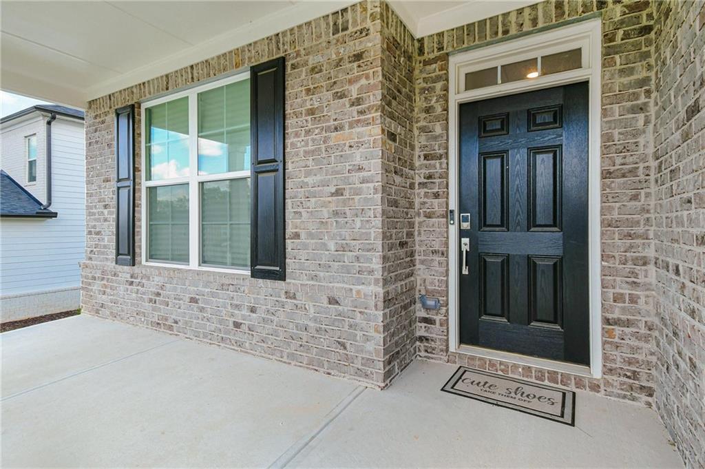 4774 Mock Orange Street Atlanta, GA 30331 - Photo 4 of 29 front view of a brick house with a large windows