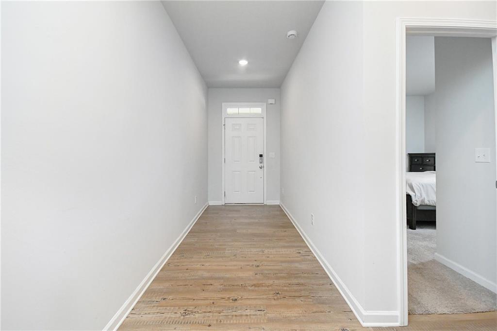 4774 Mock Orange Street Atlanta, GA 30331 - Photo 6 of 29 a view of a hallway with wooden floor