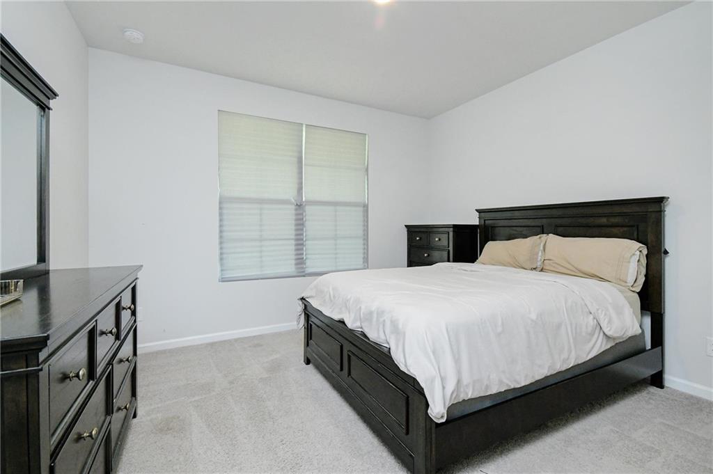 4774 Mock Orange Street Atlanta, GA 30331 - Photo 7 of 29 a bedroom with a bed and window