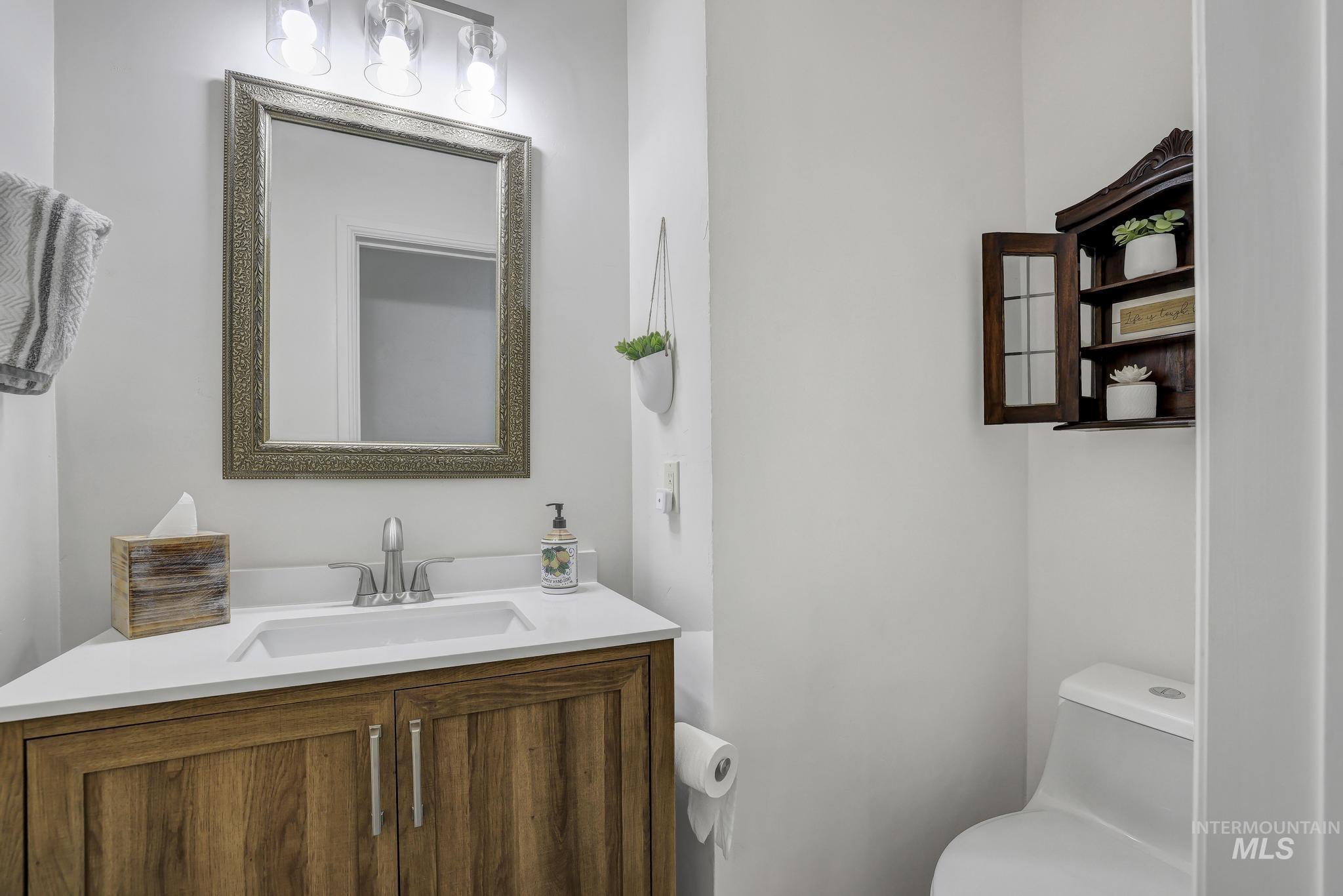 102 Fillmore Street Twin Falls, ID 83301 - Photo 19 of 48 Half bathroom with vanity and toilet