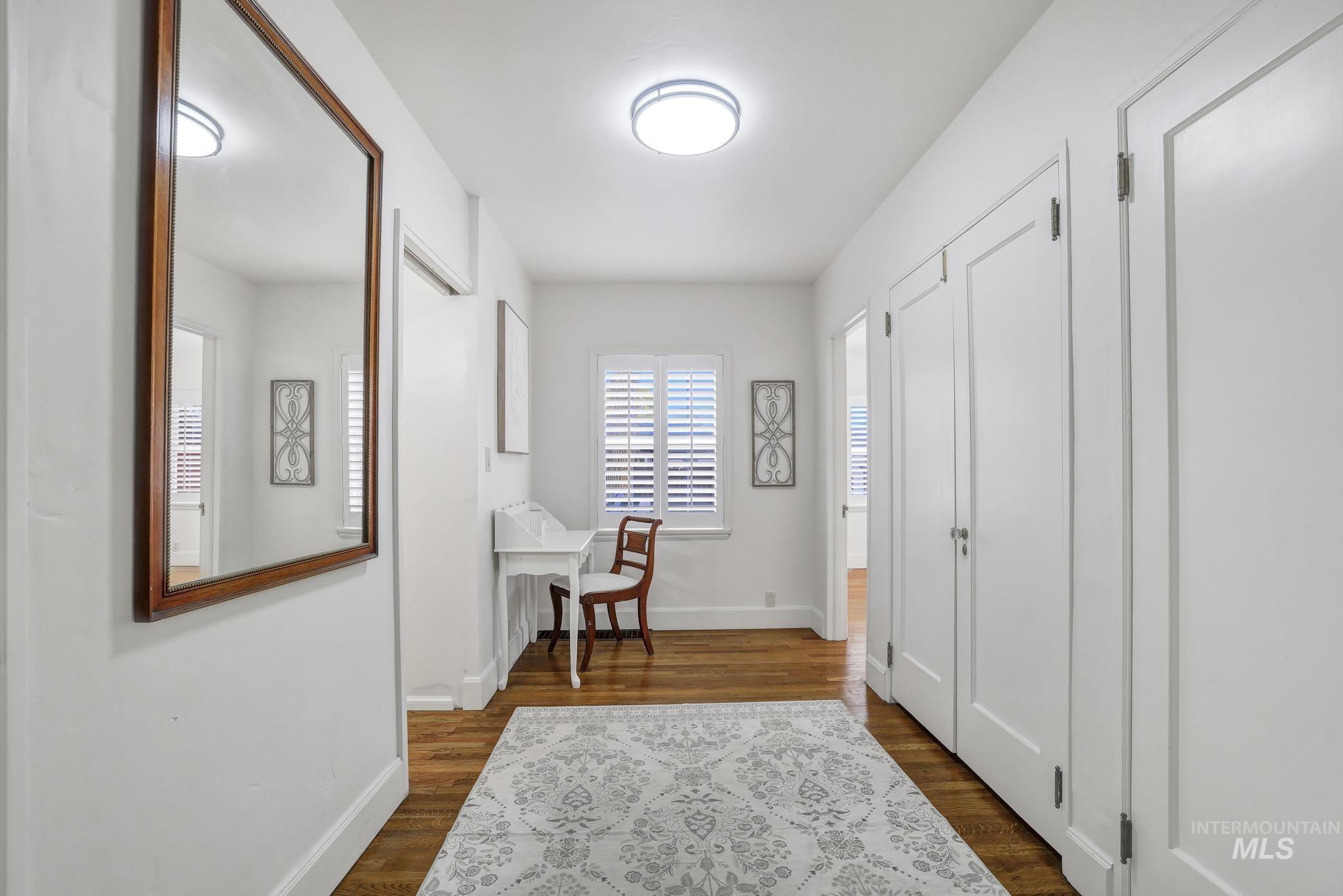 102 Fillmore Street Twin Falls, ID 83301 - Photo 20 of 48 Hall with dark wood-style flooring and baseboards
