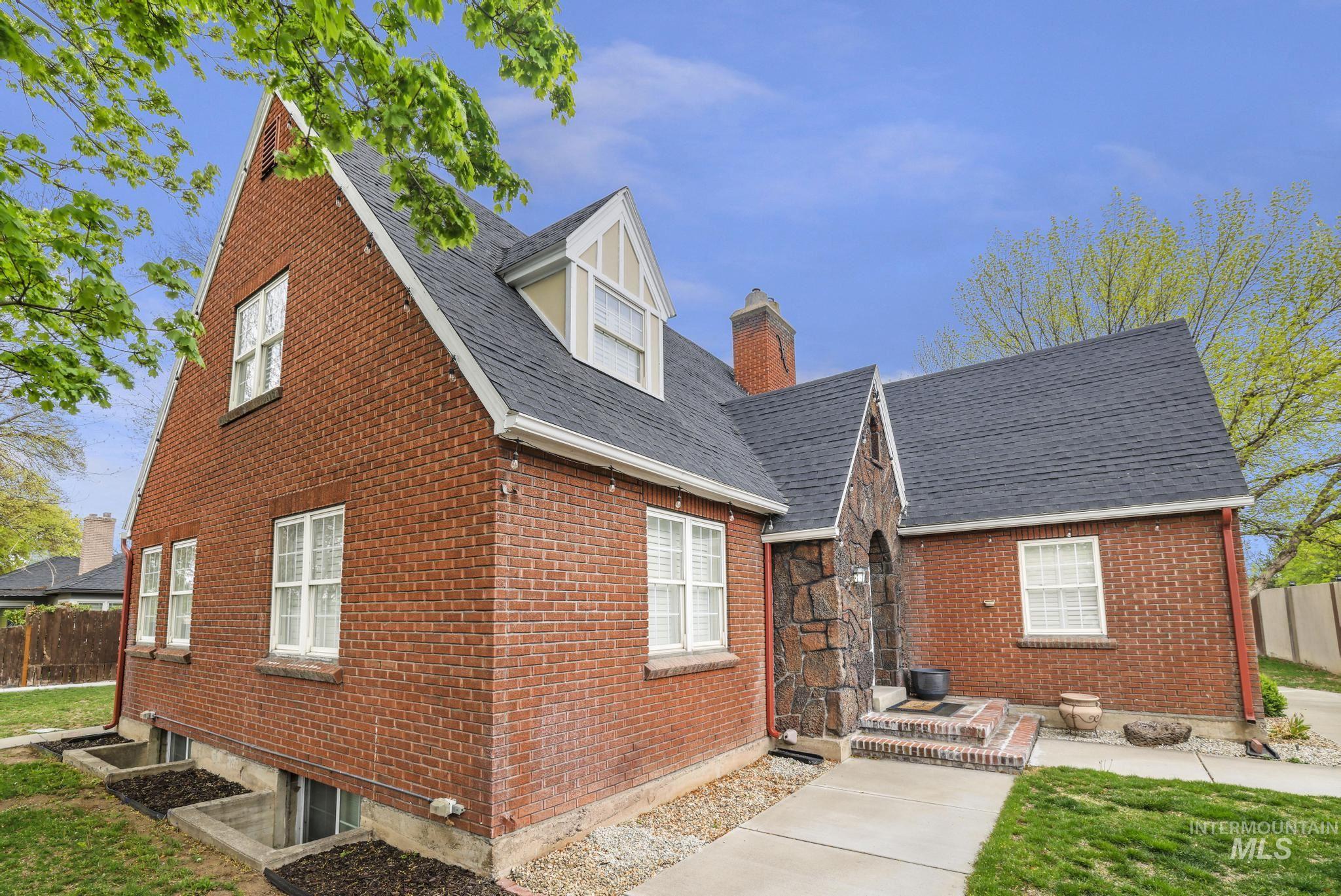 102 Fillmore Street Twin Falls, ID 83301 - Photo 2 of 48 Back of house with brick siding and a chimney