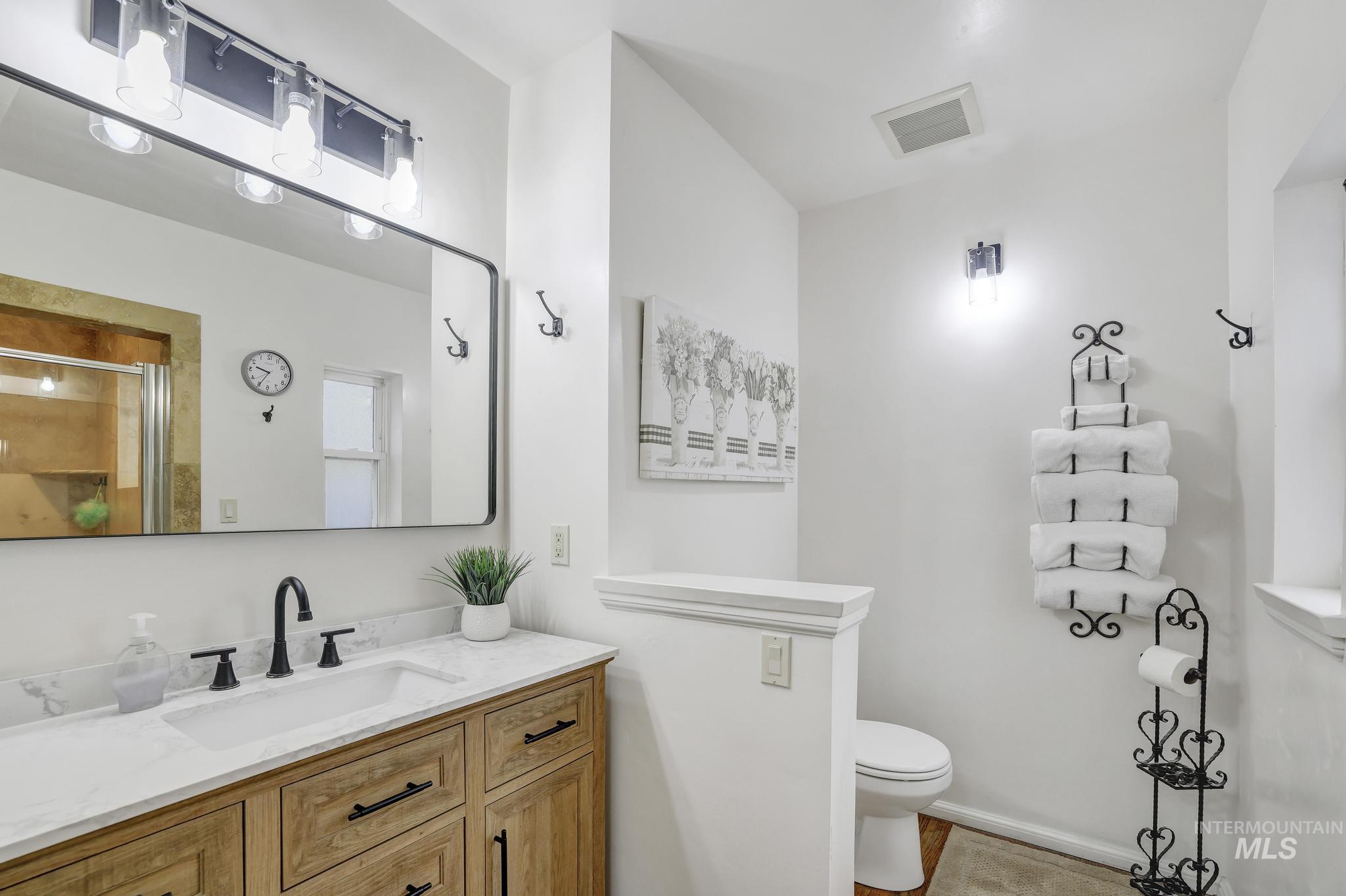 102 Fillmore Street Twin Falls, ID 83301 - Photo 21 of 48 Bathroom with vanity and a shower with door