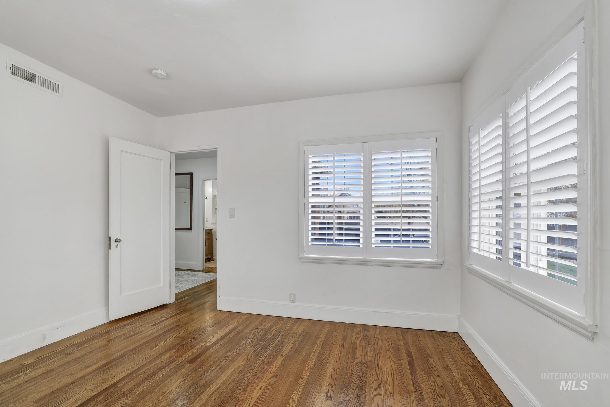 102 Fillmore Street Twin Falls, ID 83301 - Photo 23 of 48 Unfurnished room with baseboards and dark wood-style flooring