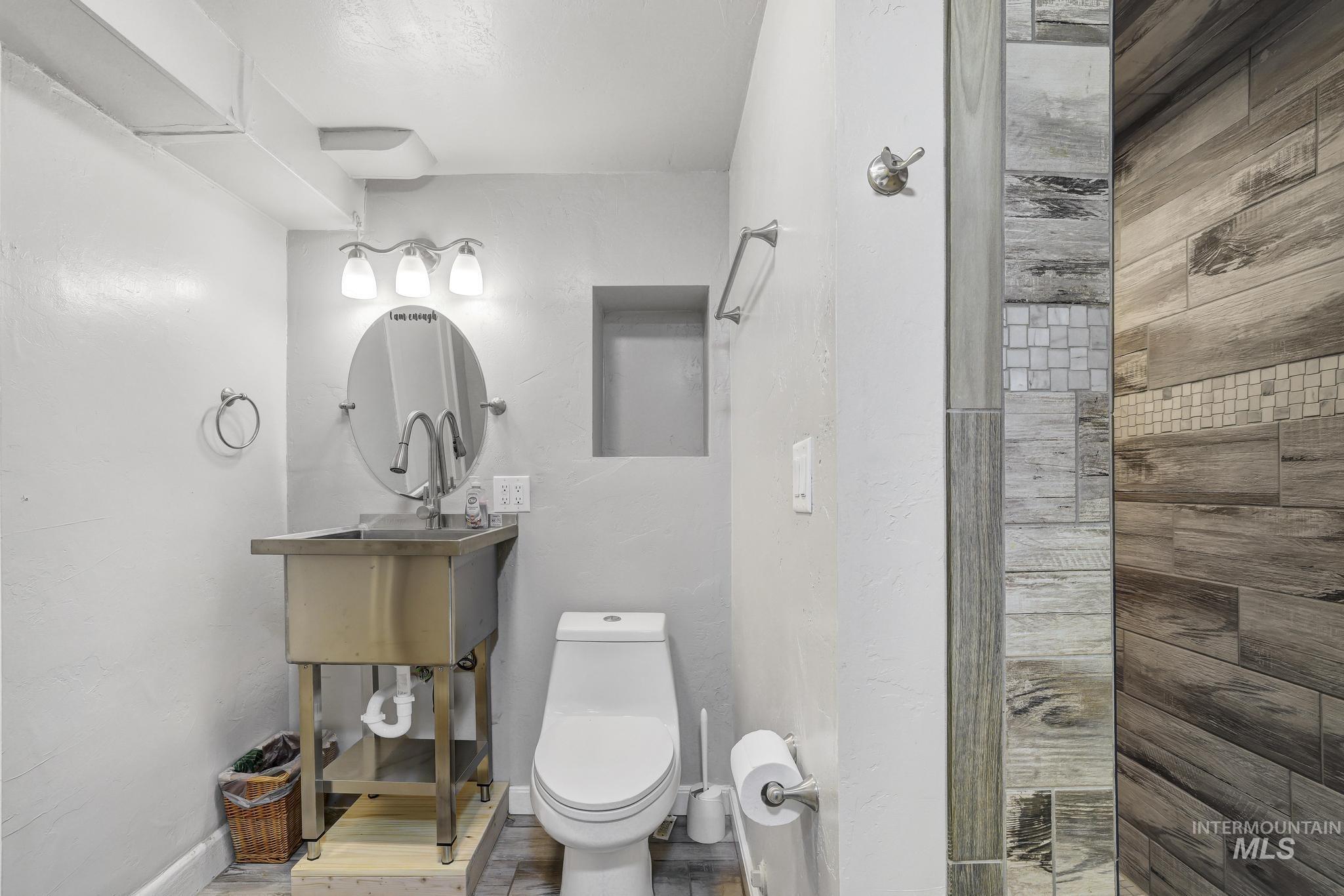 102 Fillmore Street Twin Falls, ID 83301 - Photo 26 of 48 Full bath featuring wood finished floors and vanity