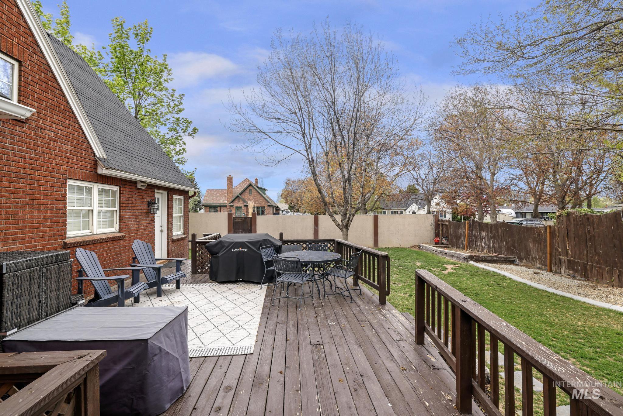 102 Fillmore Street Twin Falls, ID 83301 - Photo 41 of 48 Deck featuring grilling area, a fenced backyard, and outdoor dining area
