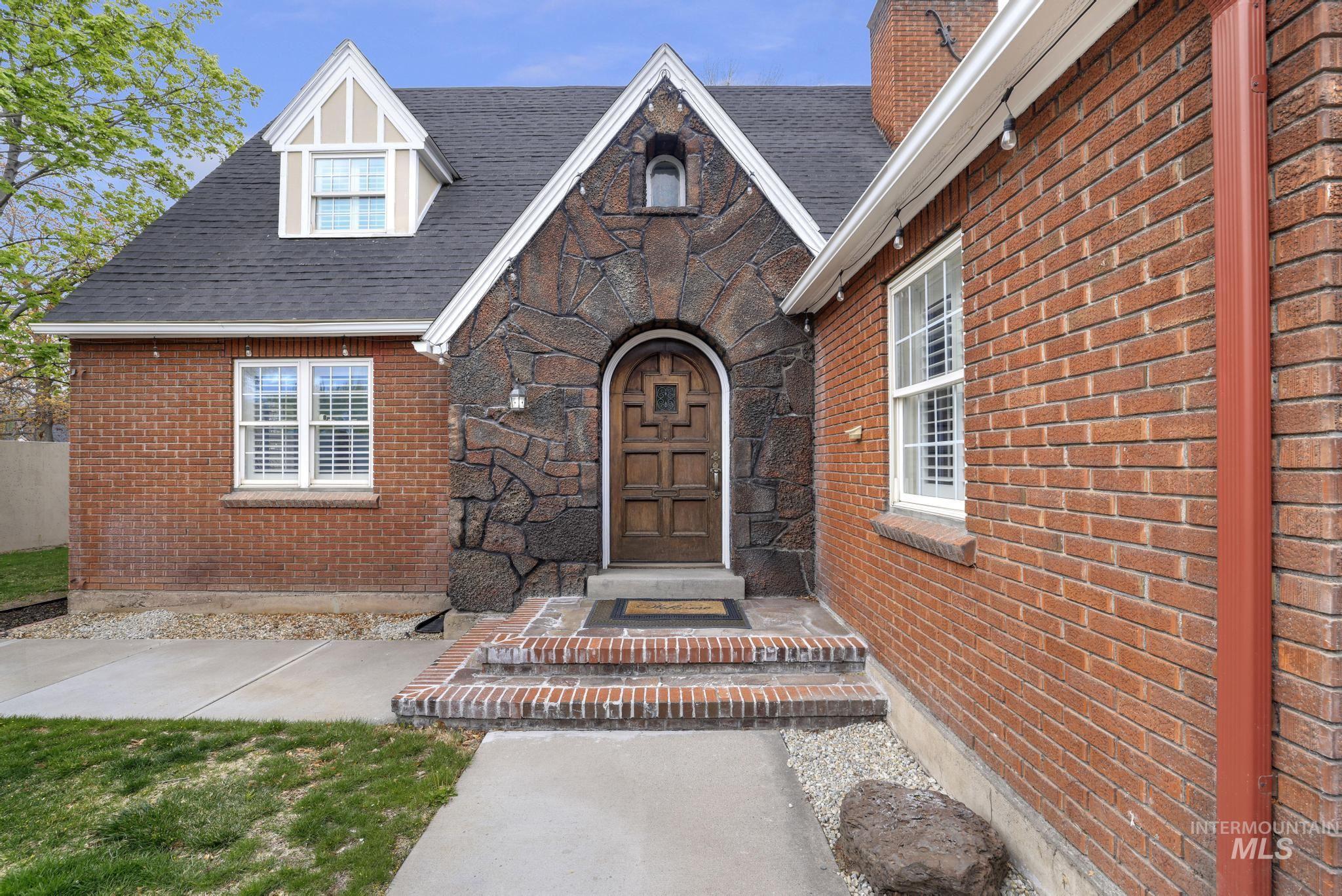 102 Fillmore Street Twin Falls, ID 83301 - Photo 8 of 48 Property entrance with brick siding and roof with shingles