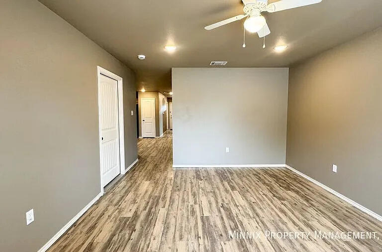 517 44th Street Lubbock, TX 79404 - Photo 4 of 10 a view of empty room with wooden floor