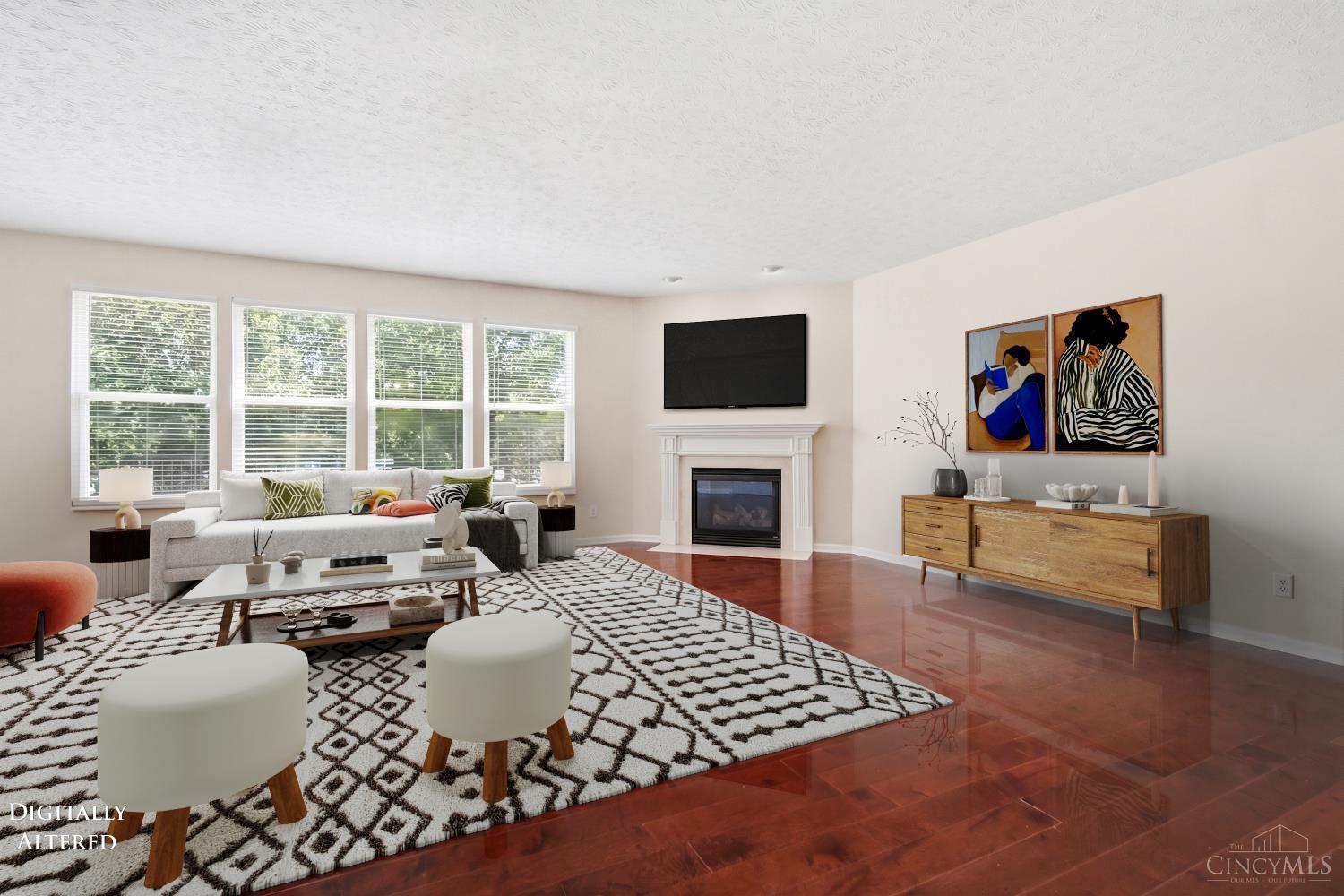 4431 Springfield Lane Mason, OH 45040 - Photo 12 of 52 Expansive living room featuring beautiful hardwood floors and a cozy fireplace