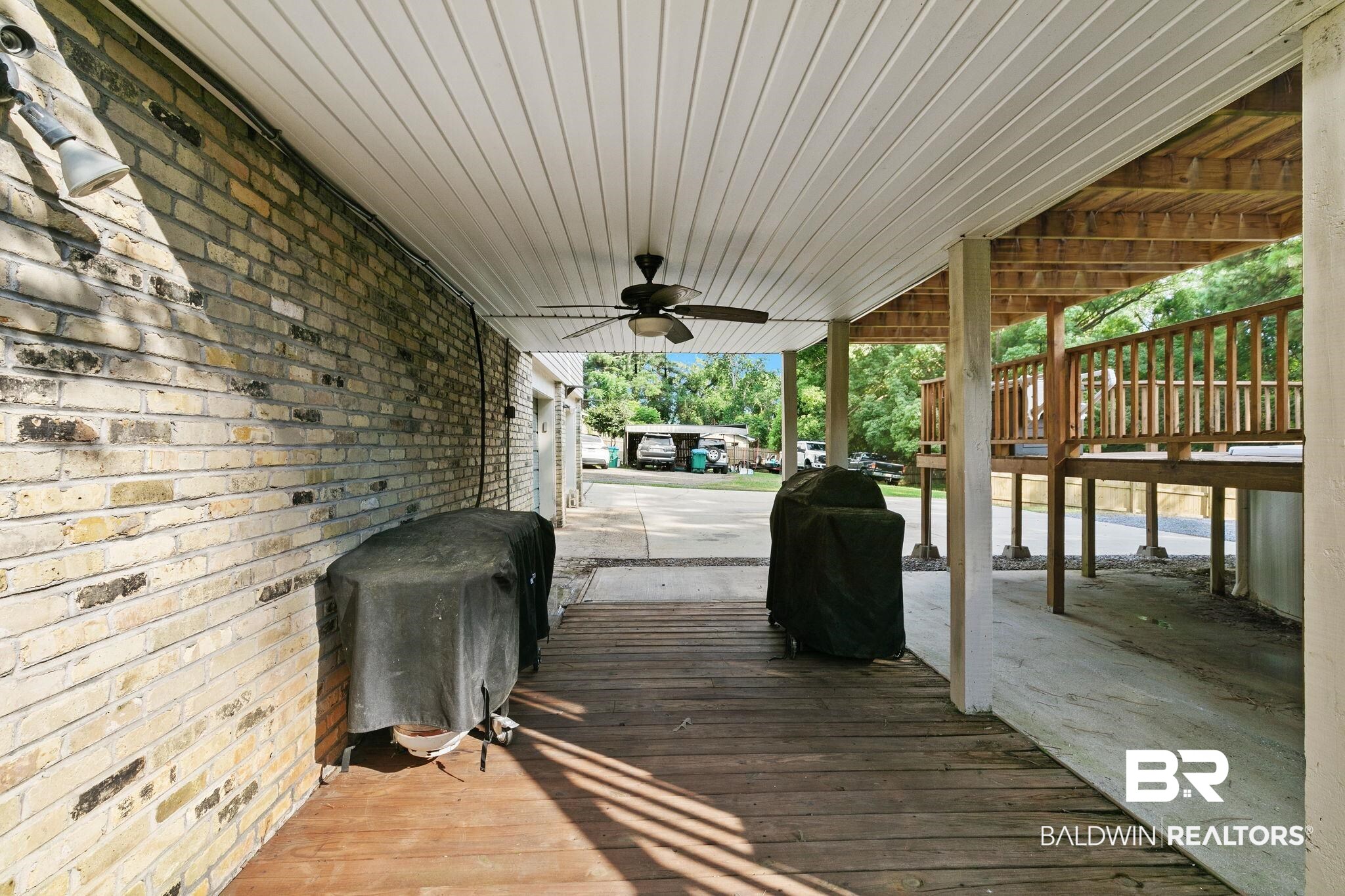 14 Lee Circle Daphne, AL 36527 - Photo 68 of 83 Wooden deck with ceiling fan
