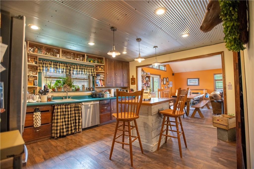 702 Keister Road Venus, PA 16364 - Photo 16 of 39 a view of a dining room with furniture window and wooden floor