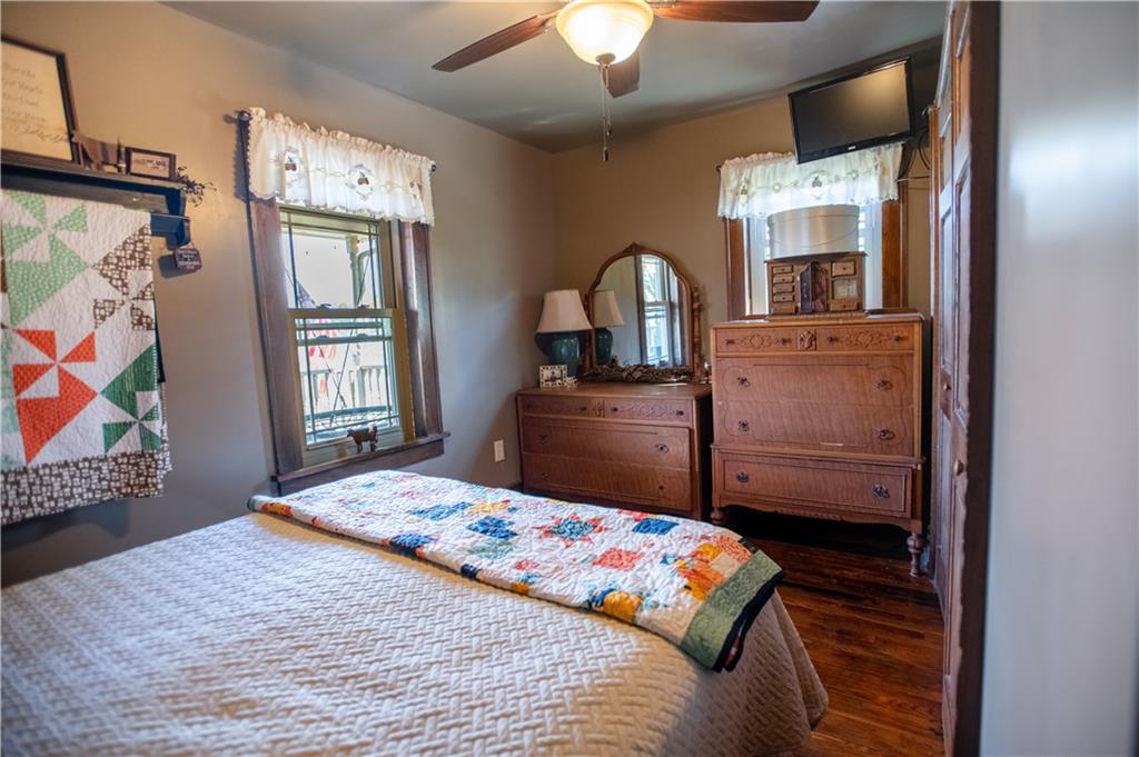 702 Keister Road Venus, PA 16364 - Photo 18 of 39 a bedroom with a bed and a dresser
