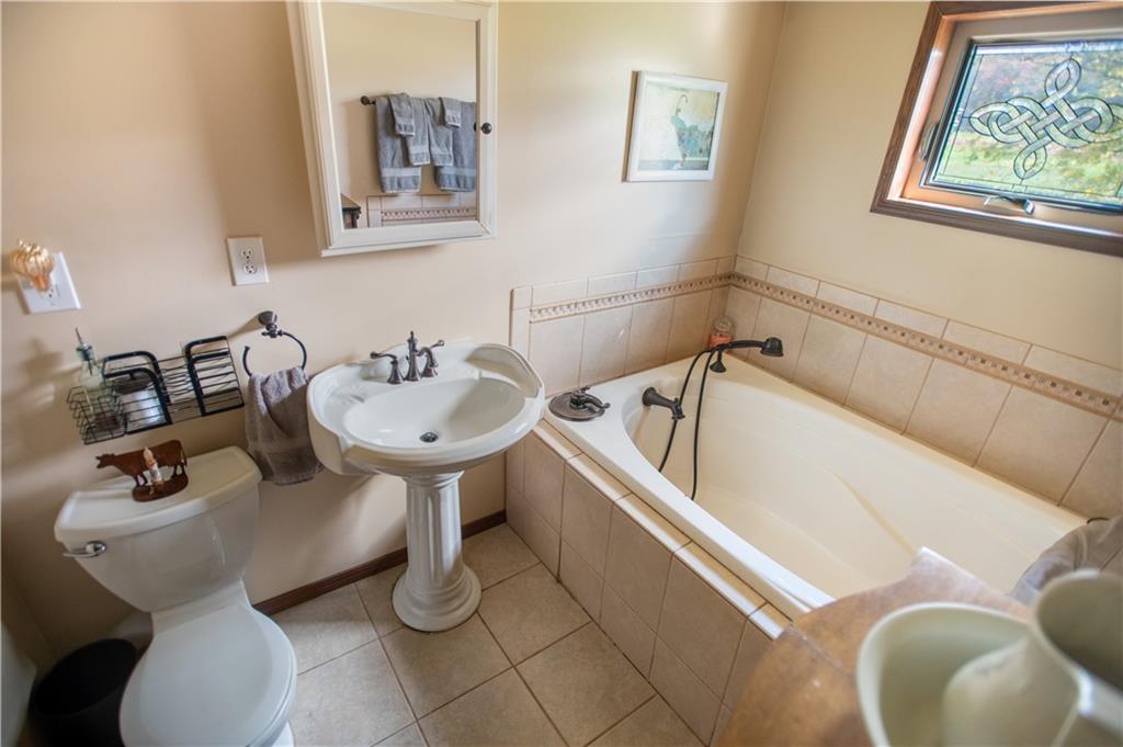 702 Keister Road Venus, PA 16364 - Photo 19 of 39 a bathroom with a sink and mirror