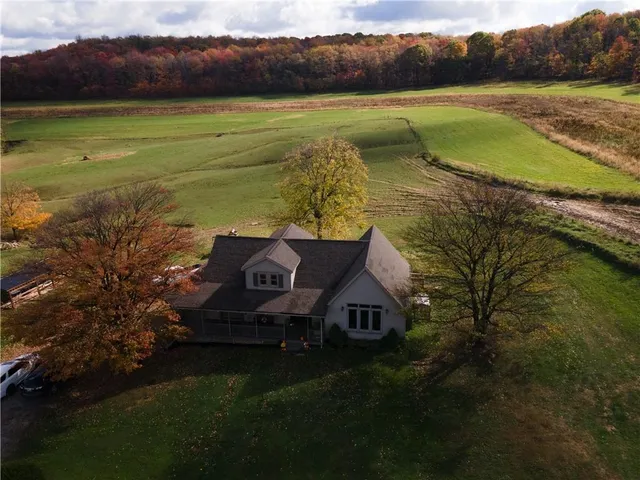 a view of a lake with a house in the background