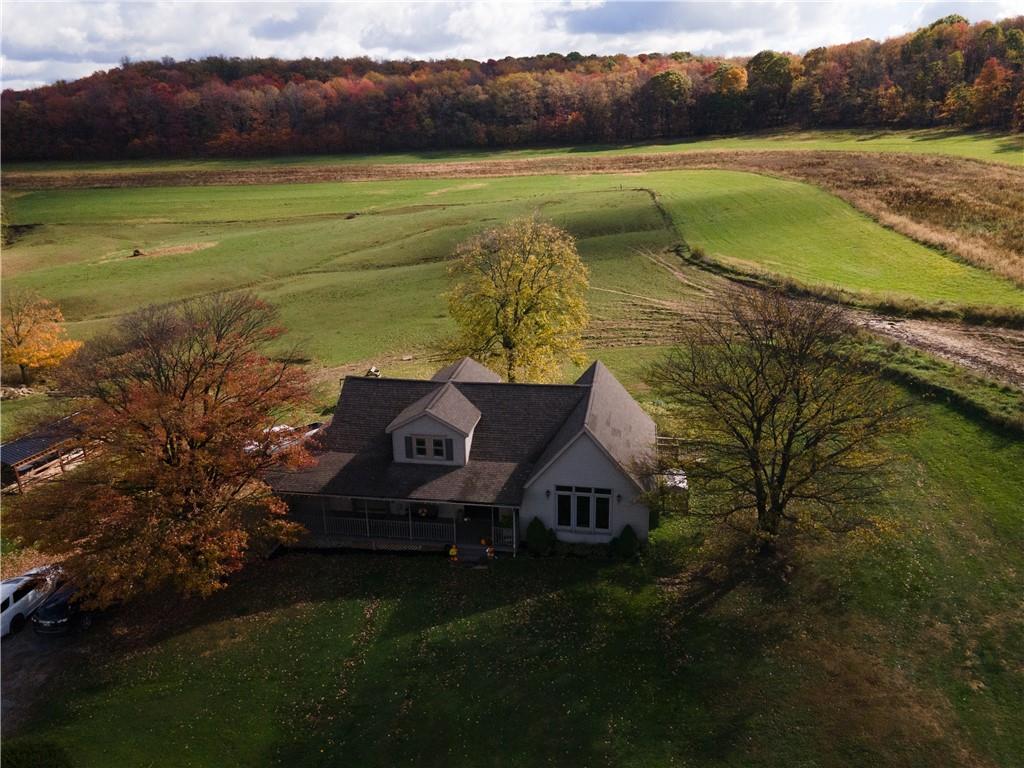 702 Keister Road Venus, PA 16364 - Photo 2 of 39 a view of a lake with a house in the background