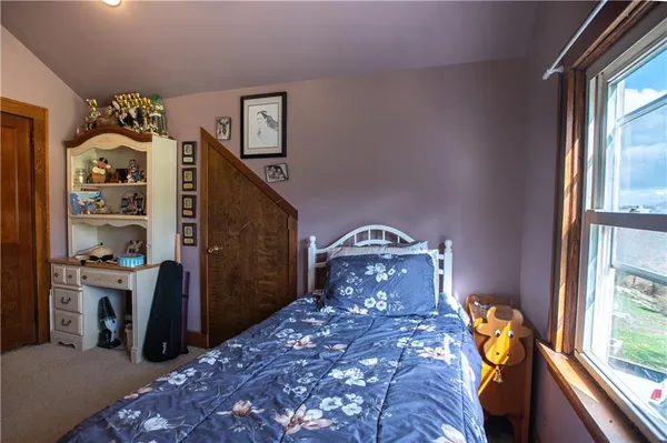 a bedroom with furniture and a bed