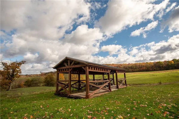 a view of a lake with huge green field