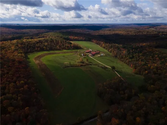 aerial view of a house with a yard