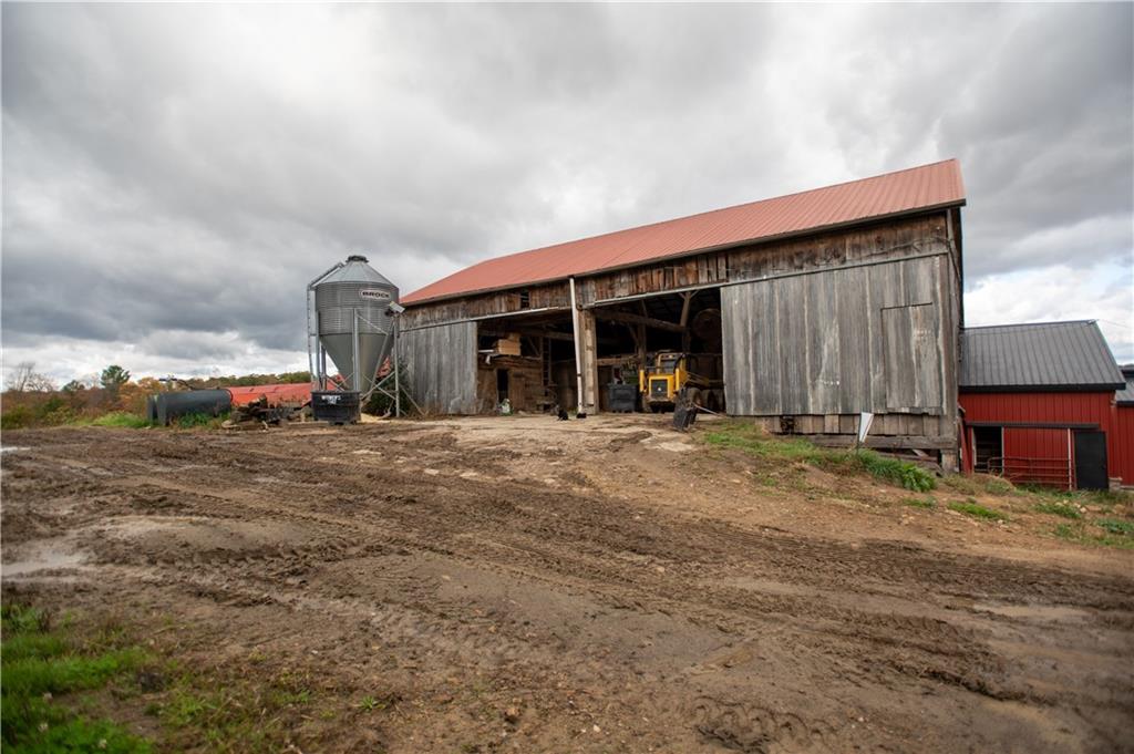 702 Keister Road Venus, PA 16364 - Photo 32 of 39 a front view of a house with a yard and garage