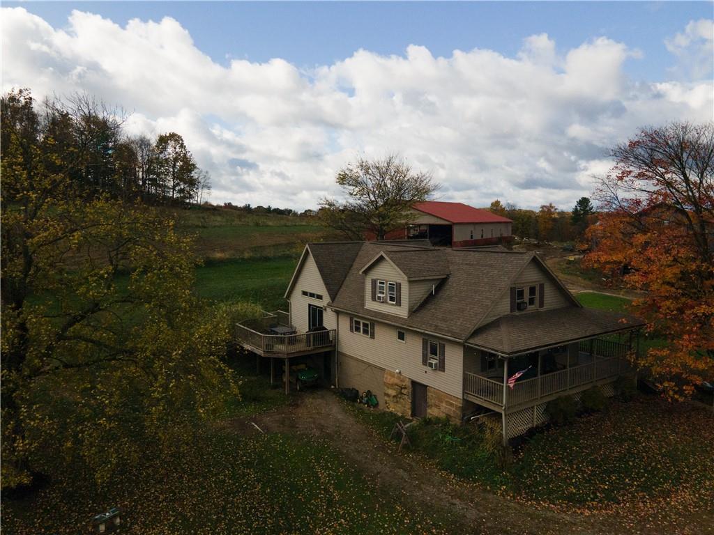 702 Keister Road Venus, PA 16364 - Photo 38 of 39 an aerial view of a house with a yard table and chairs