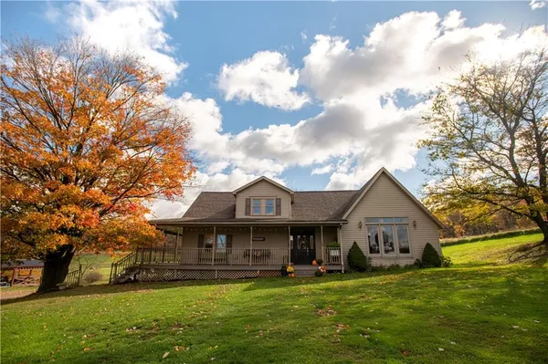 a front view of a house with garden