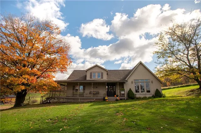 a front view of a house with garden