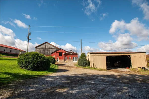 a view of a house with wooden fence