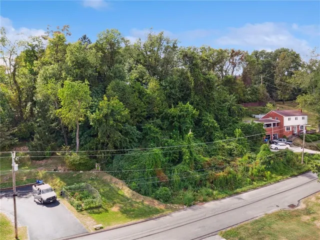 a view of a lake with a house in the background