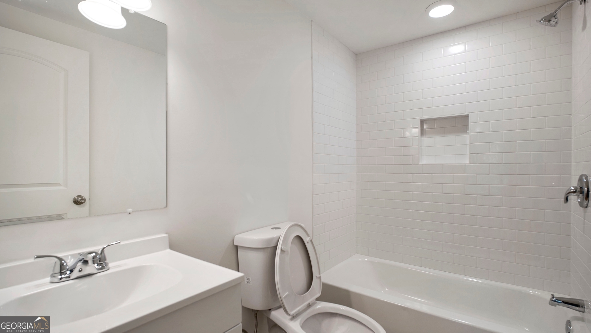 79 Terry Drive Midway, GA 31320 - Photo 16 of 27 a bathroom with a bathtub shower sink mirror and toilet