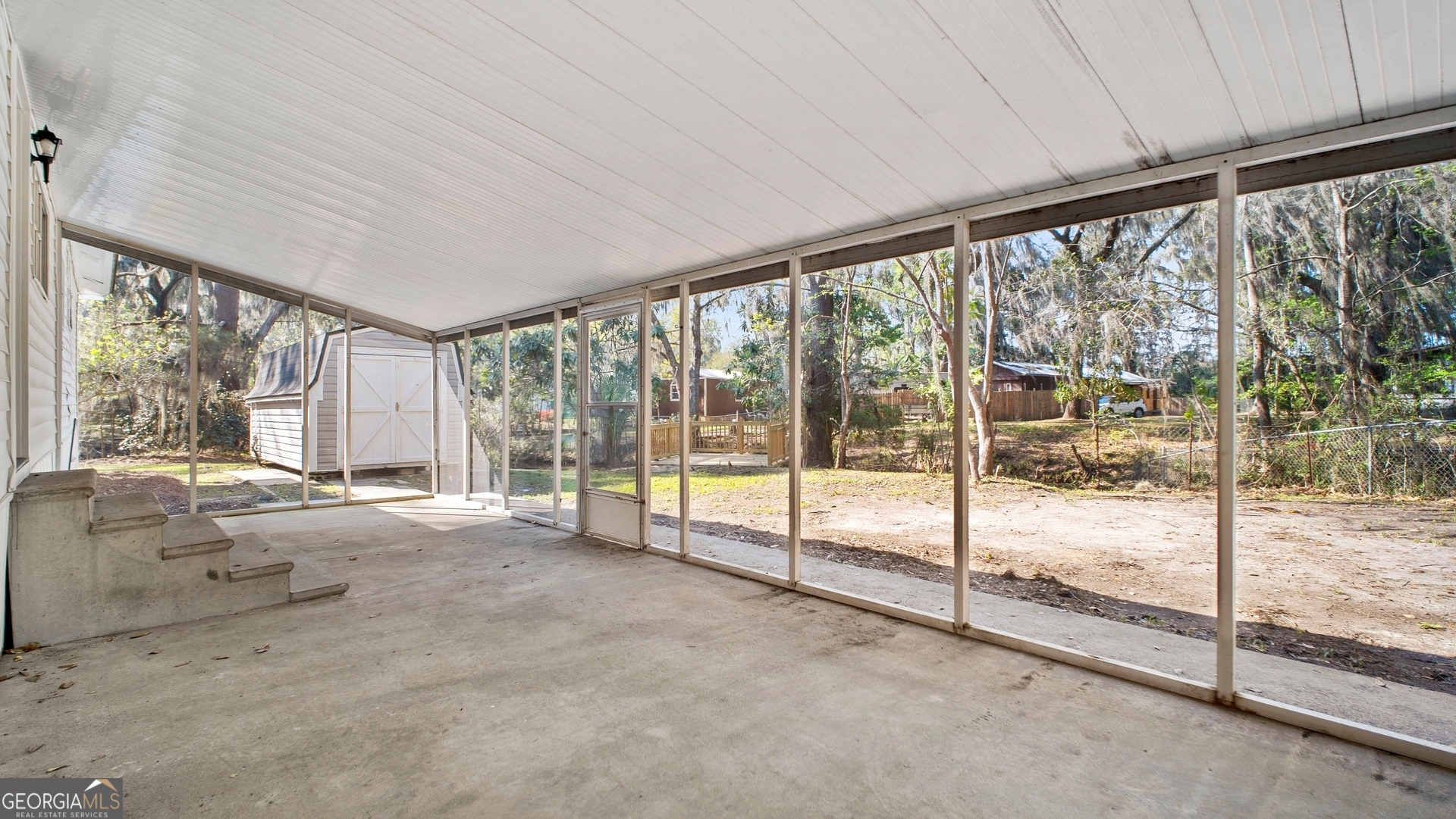 79 Terry Drive Midway, GA 31320 - Photo 20 of 27 a view of an empty room and window