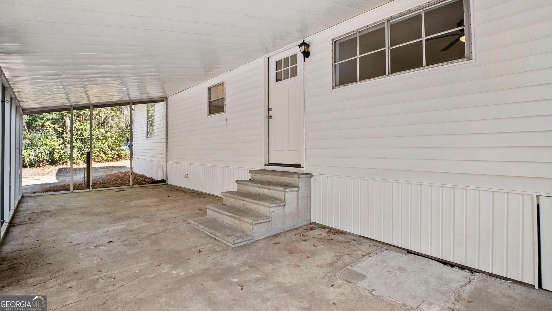79 Terry Drive Midway, GA 31320 - Photo 21 of 27 a view of an empty room with a window
