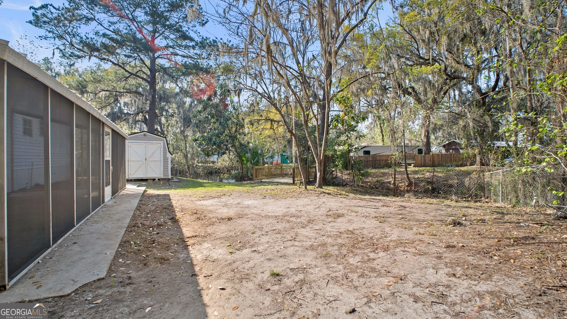 79 Terry Drive Midway, GA 31320 - Photo 23 of 27 a view of backyard with tree