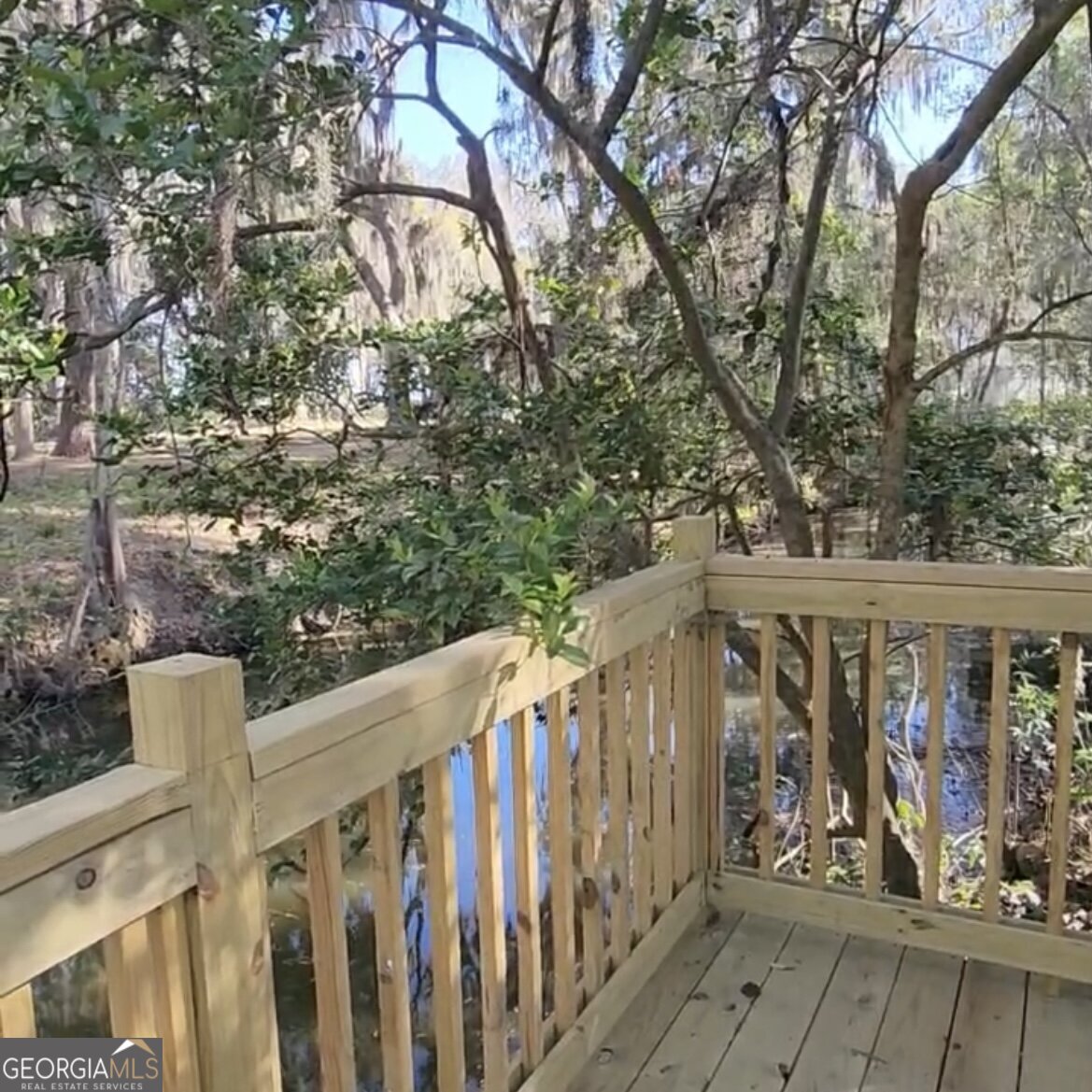 79 Terry Drive Midway, GA 31320 - Photo 25 of 27 a view of street with wooden fence and floor