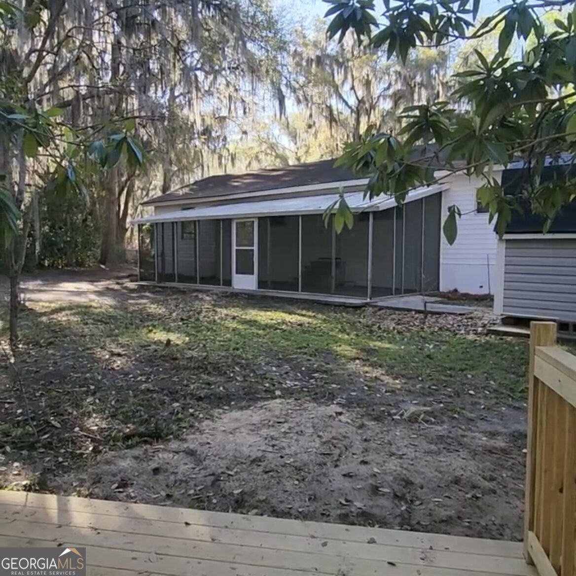 79 Terry Drive Midway, GA 31320 - Photo 27 of 27 a view of a house with a yard