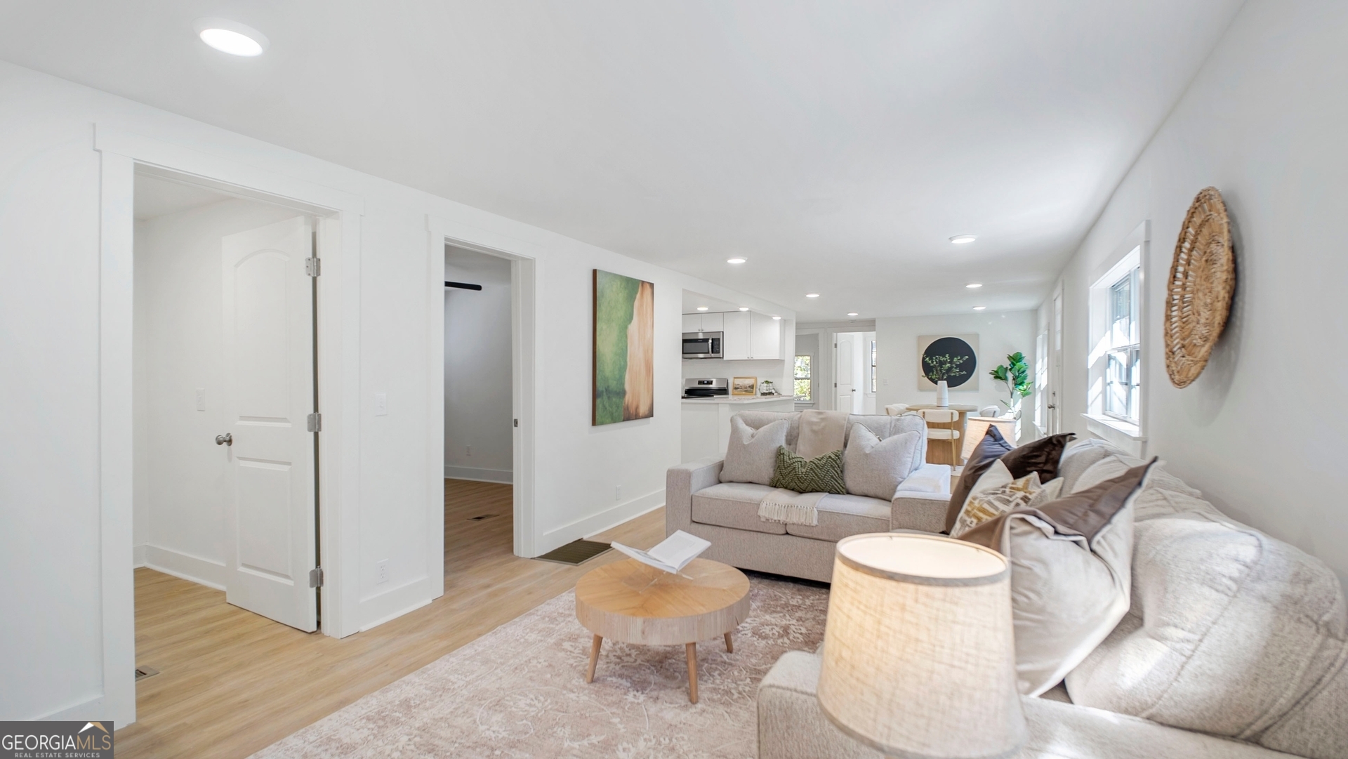 79 Terry Drive Midway, GA 31320 - Photo 5 of 27 a living room with furniture a mirror and a glass door shower