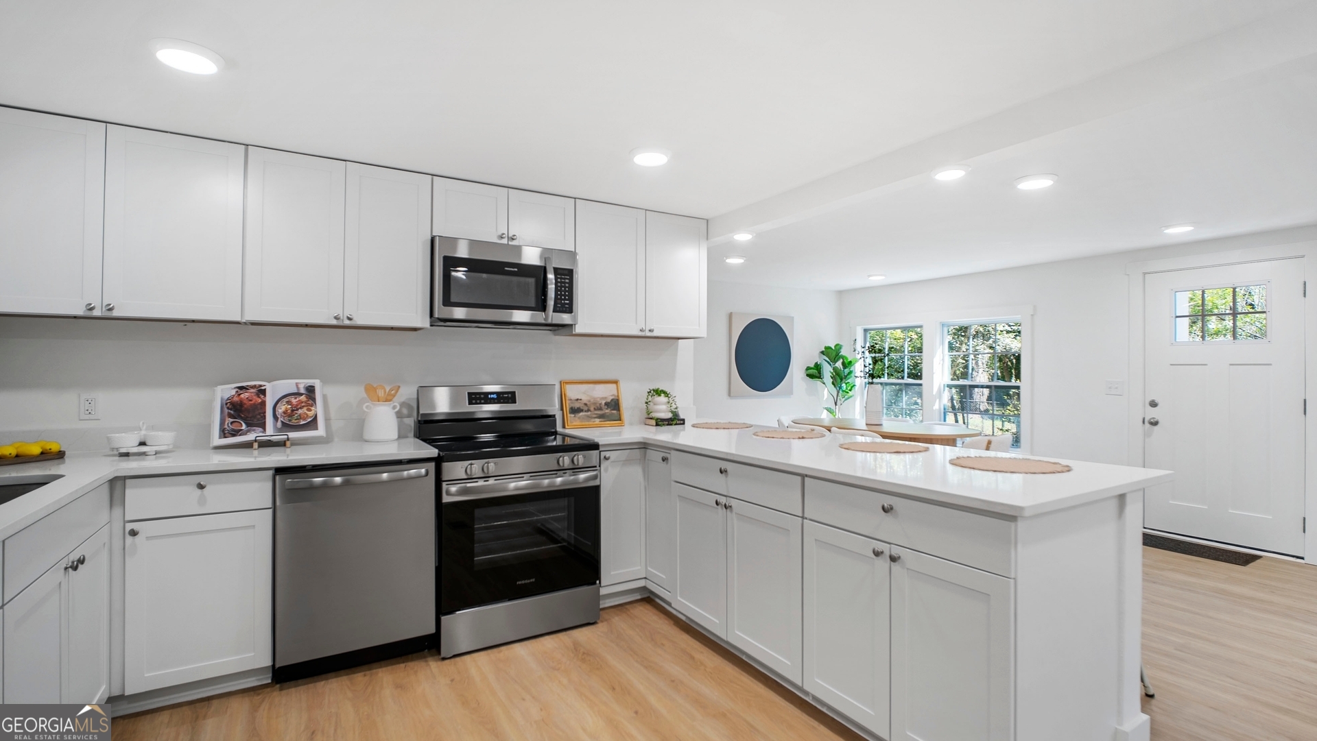 79 Terry Drive Midway, GA 31320 - Photo 8 of 27 a kitchen with a sink stove and cabinets