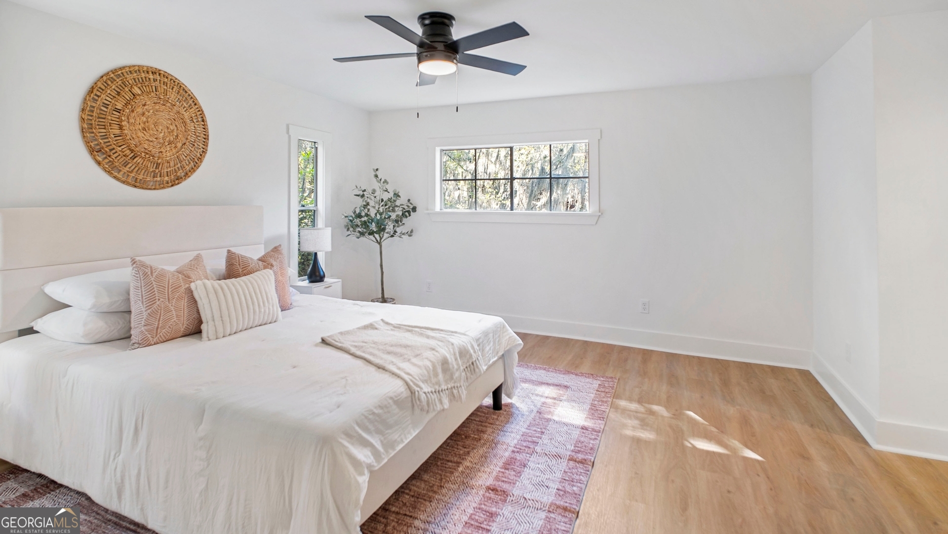 79 Terry Drive Midway, GA 31320 - Photo 10 of 27 a bedroom with a large bed and a window