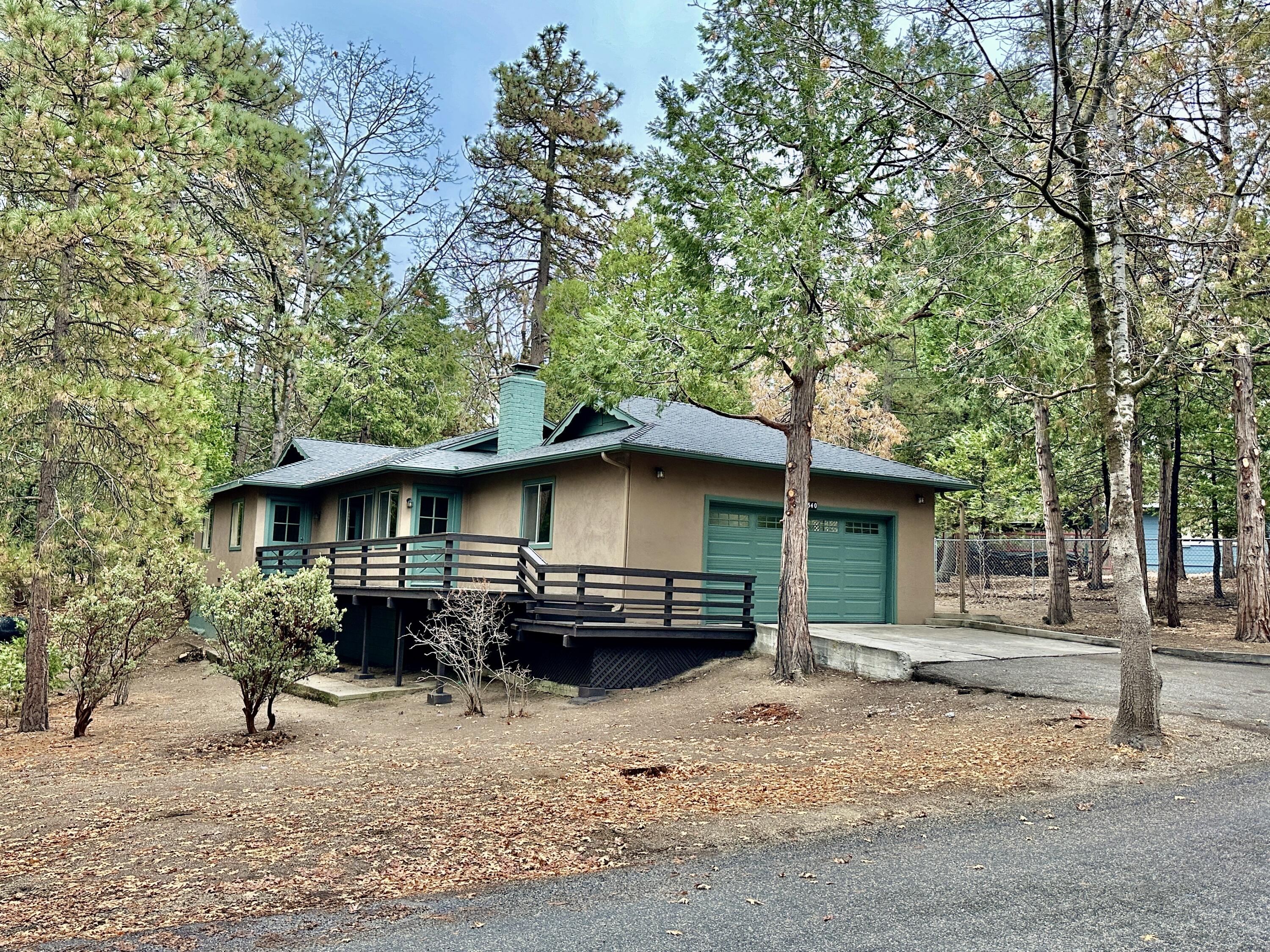 a view of a house with a yard covered in snow