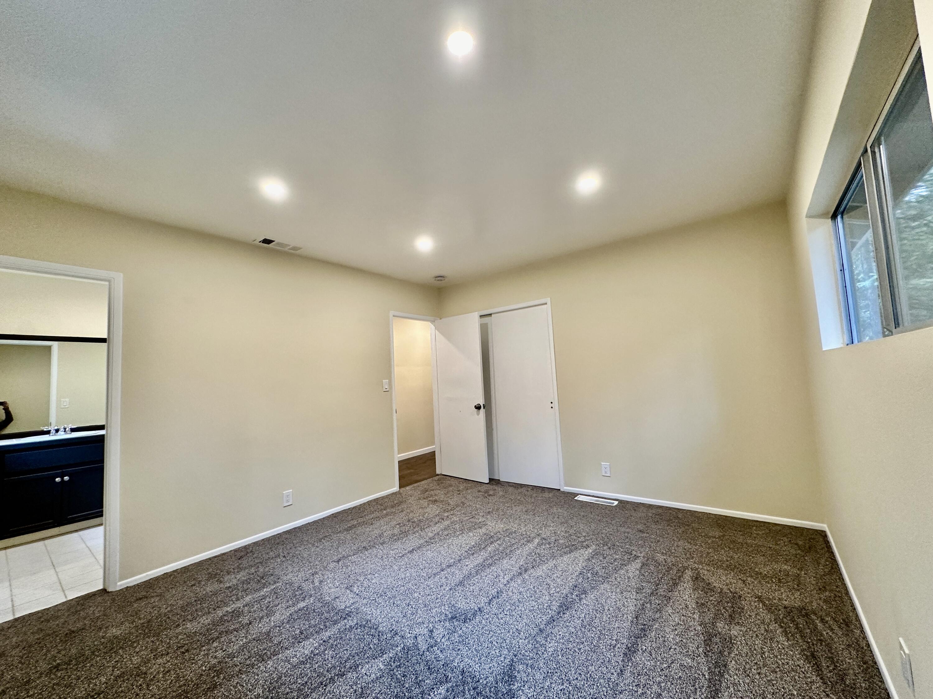 25340 Marion Ridge Drive Idyllwild, CA 92549 - Photo 15 of 31 an empty room with wooden floor and windows