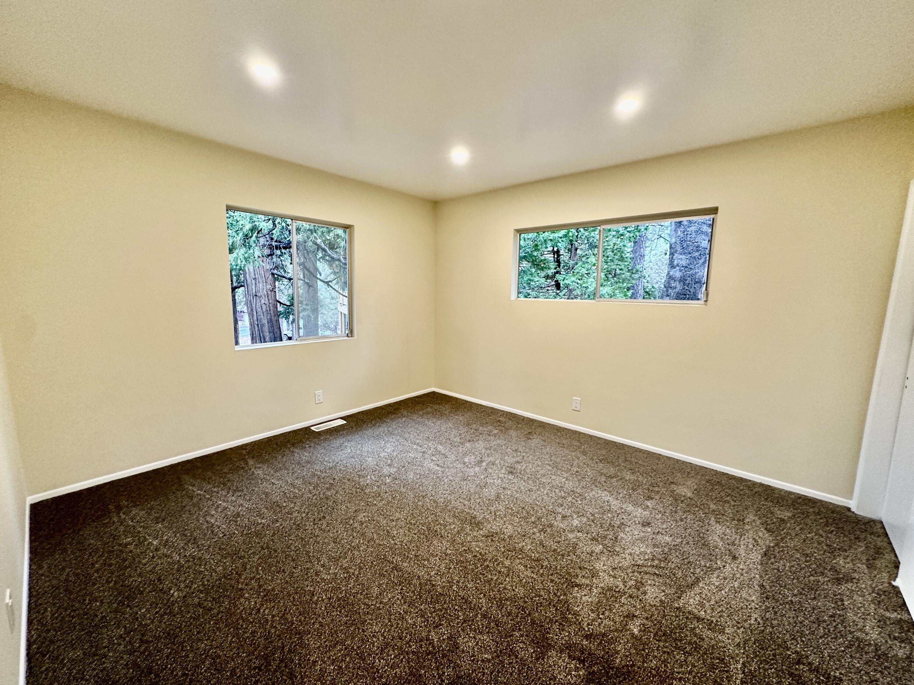 25340 Marion Ridge Drive Idyllwild, CA 92549 - Photo 18 of 31 an empty room with a painting on the wall