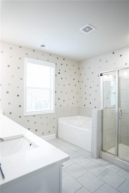 2215 A Manor Pointe Drive Cumming, GA 30041 - Photo 17 of 49 a bathroom with a bathtub and a shower
