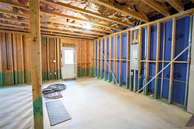 an empty room with wooden floor