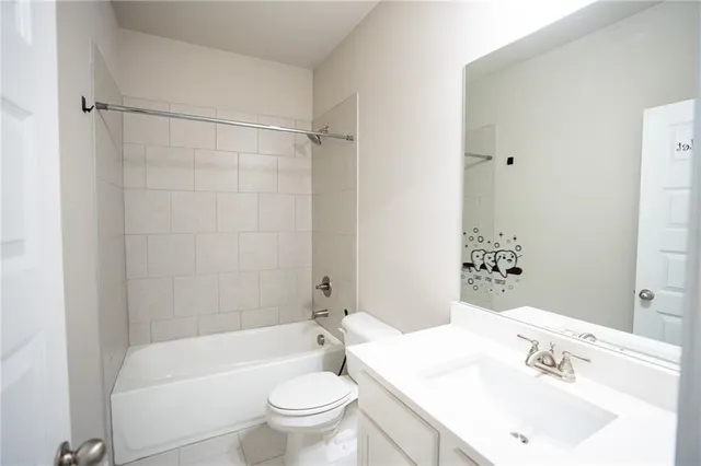 a bathroom with a sink a vanity and a bathtub