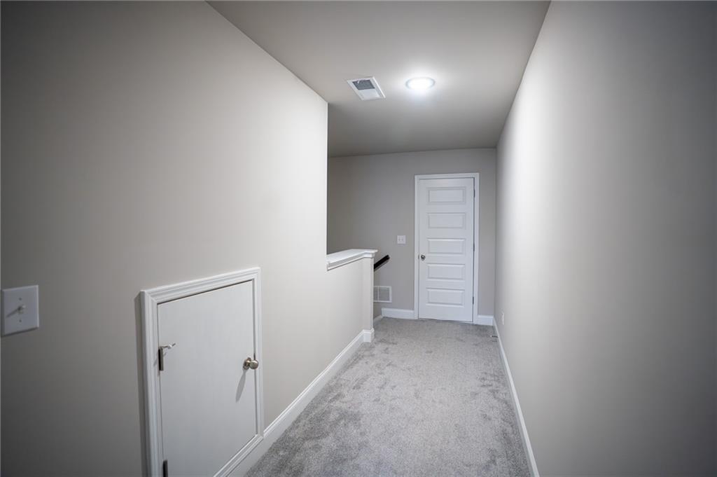 2215 A Manor Pointe Drive Cumming, GA 30041 - Photo 43 of 49 a view of hallway with stairs