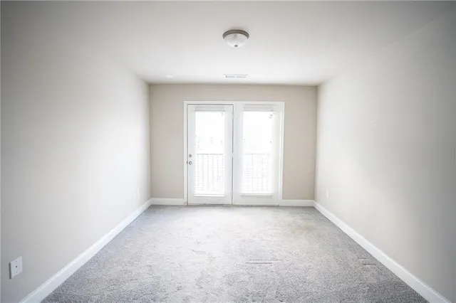 a view of a hallway with stairs