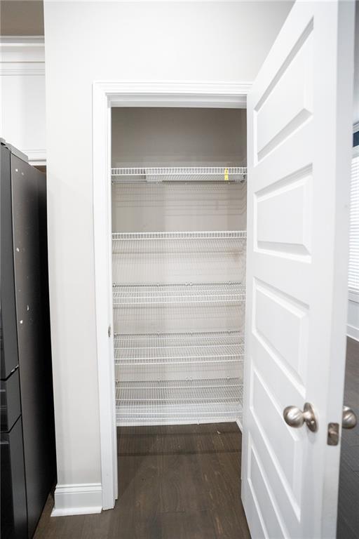 2215 A Manor Pointe Drive Cumming, GA 30041 - Photo 48 of 49 a view of walk in closet with empty racks