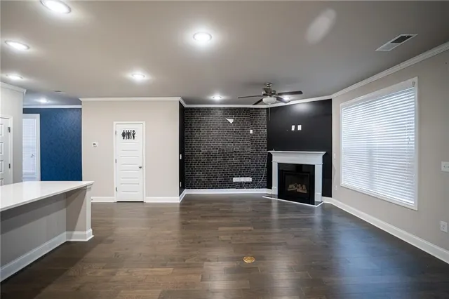 a view of a kitchen with a sink and a fireplace