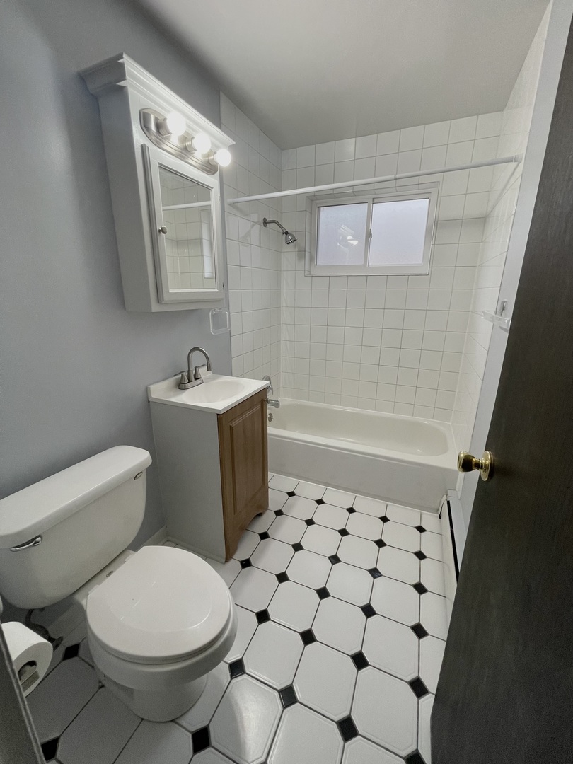 3642 147th Place Midlothian, IL 60445 - Photo 13 of 16 a bathroom with a sink toilet and shower