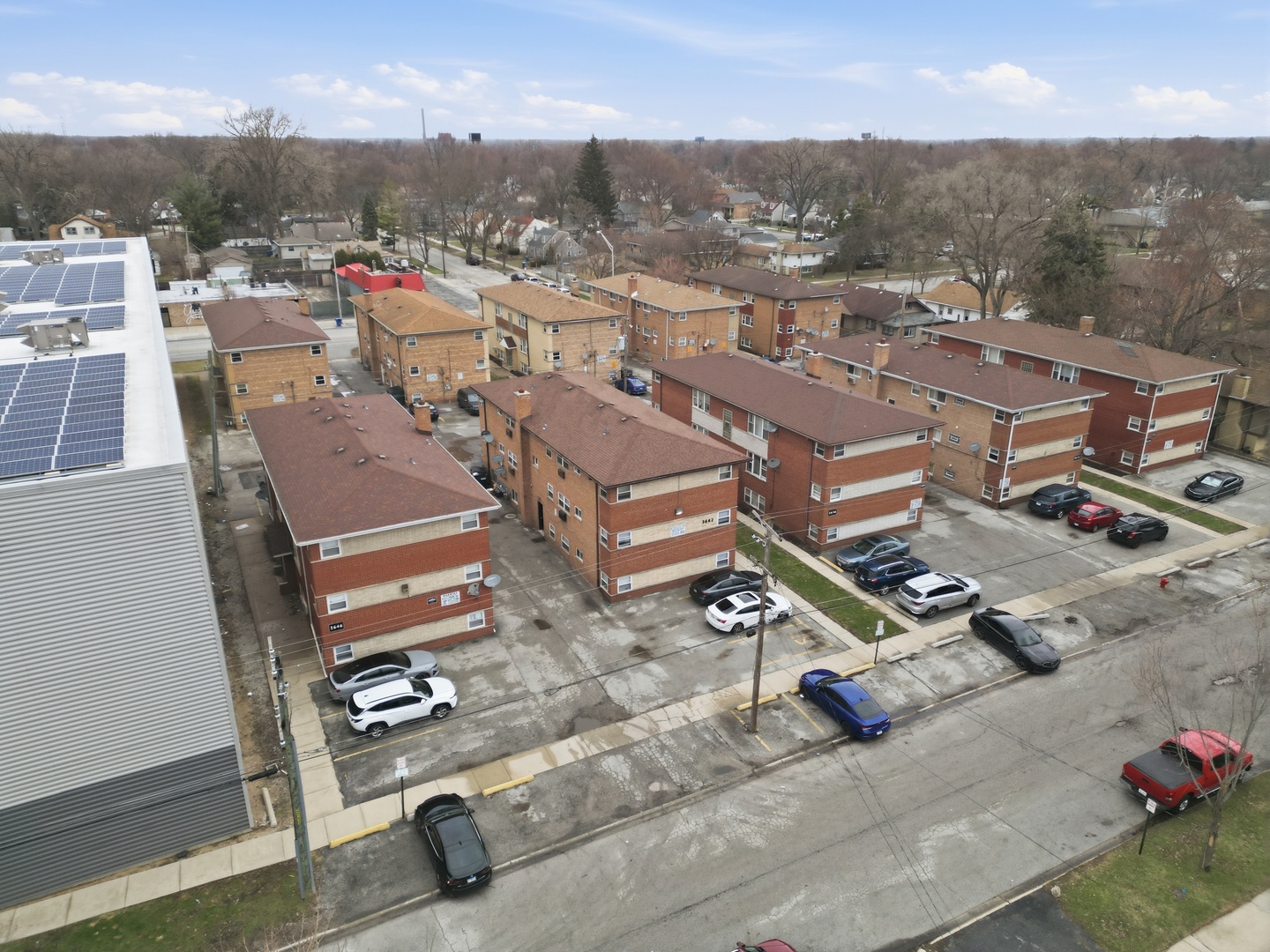 3642 147th Place Midlothian, IL 60445 - Photo 6 of 16 an aerial view of a city with streets and houses