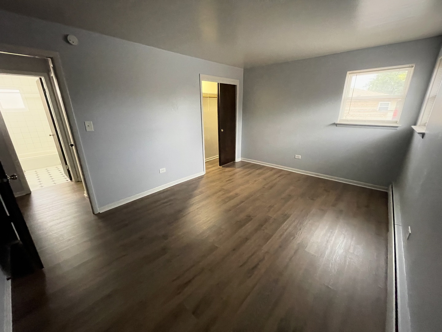 3642 147th Place Midlothian, IL 60445 - Photo 9 of 16 an empty room with wooden floor and windows